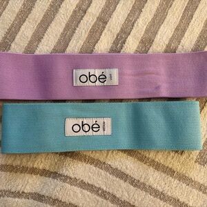Obé Fitness Resistance Bands Set in Purple (light resistance) and Blue (medium)